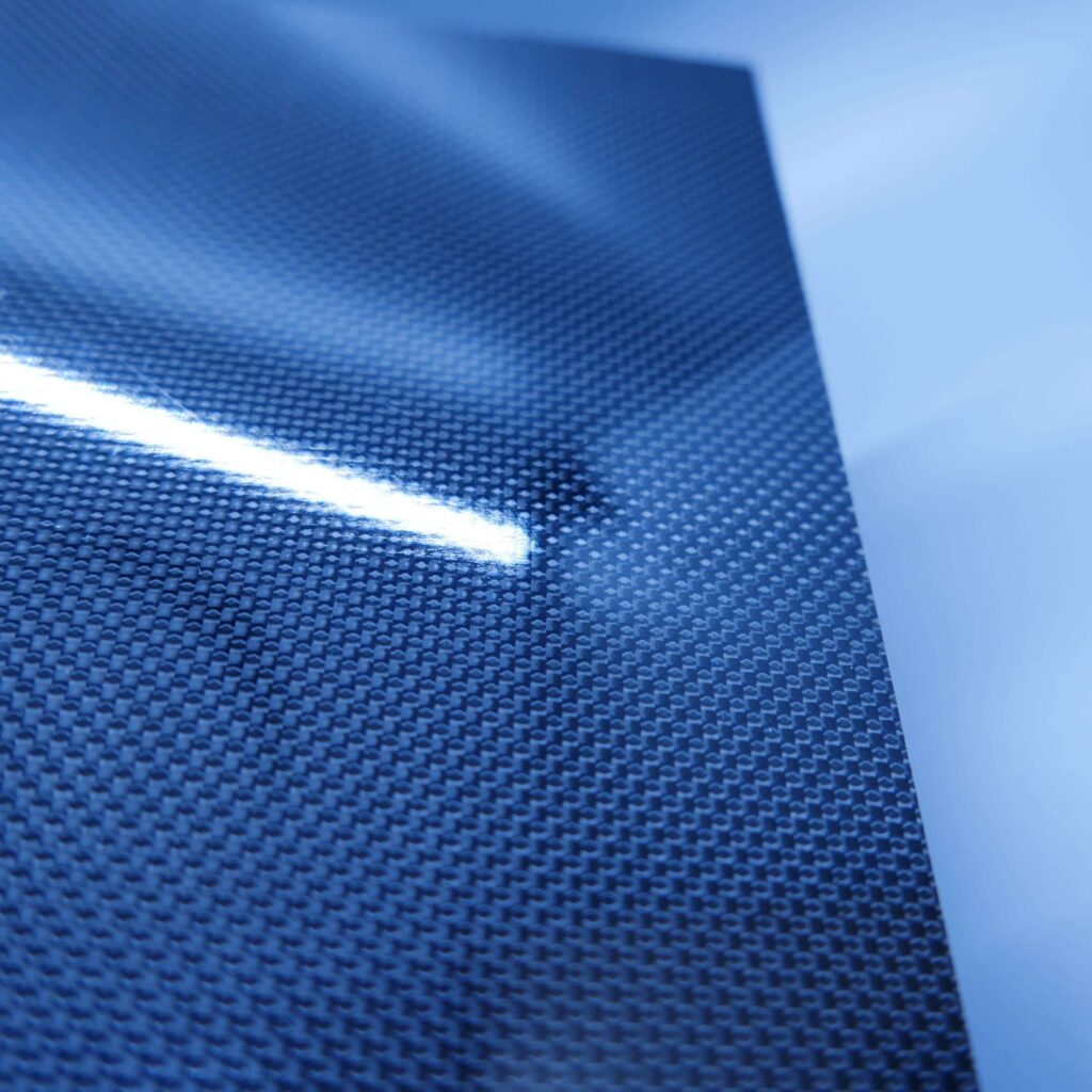 Structural carbon fiber plaque, multi-ply